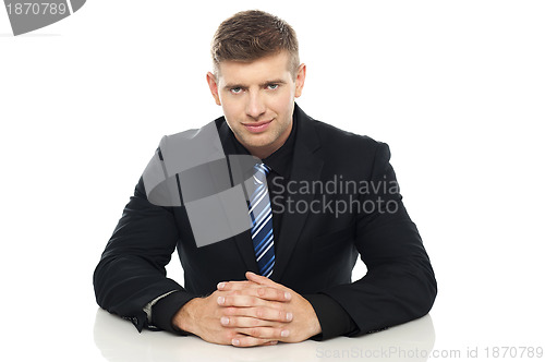 Image of Smart young business executive at his work desk