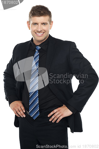 Image of Confident young businessman posing casually