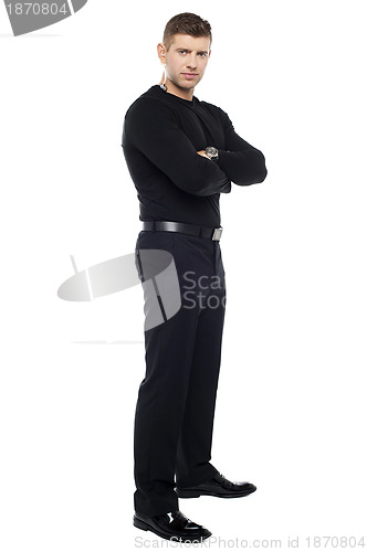 Image of Handsome young bodyguard, full length portrait