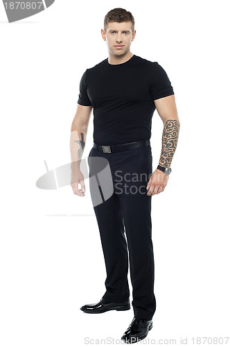 Image of Strong male bouncer. Tattoo on both his hands