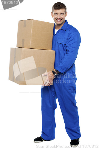 Image of Young smart relocation staff carrying cartons