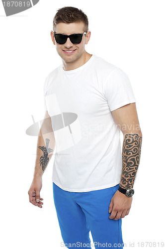 Image of Handsome guy wearing shades and posing