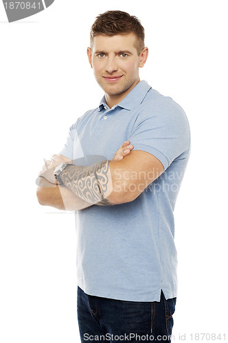 Image of Smiling young man posing in style