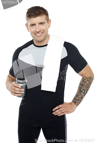 Image of Energetic fit man holding water bottle