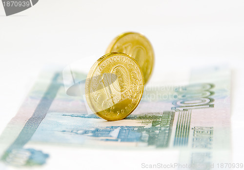 Image of Two coins on banknote isolated