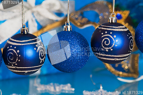 Image of  New Year's and Christmas ornaments and a carnival a mask