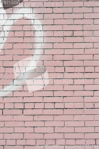 Image of pink painted brick wall