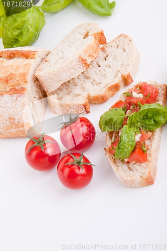 Image of deliscious fresh bruschetta appetizer with tomatoes isolated