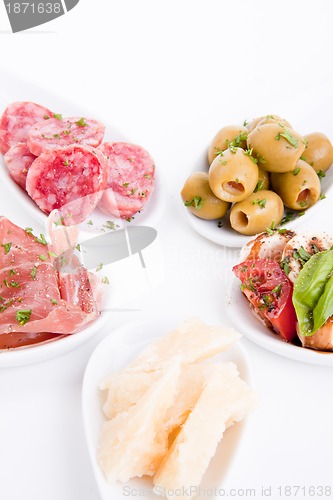 Image of deliscious antipasti plate with parma parmesan and olives