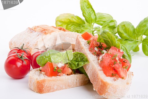 Image of deliscious fresh bruschetta appetizer with tomatoes isolated