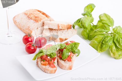 Image of deliscious fresh bruschetta appetizer with tomatoes isolated