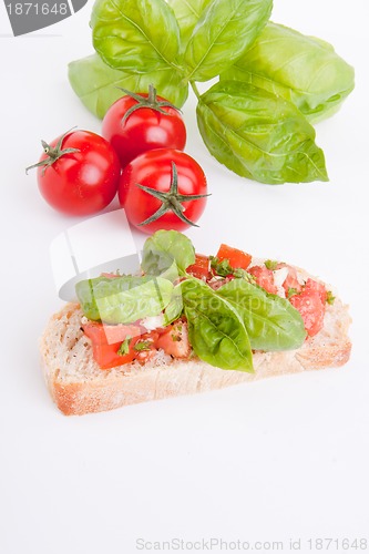 Image of deliscious fresh bruschetta appetizer with tomatoes isolated