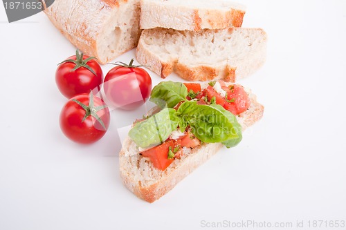 Image of deliscious fresh bruschetta appetizer with tomatoes isolated