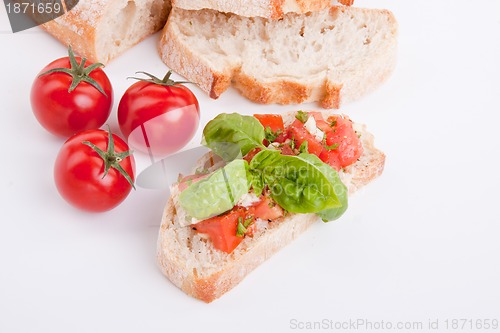 Image of deliscious fresh bruschetta appetizer with tomatoes isolated