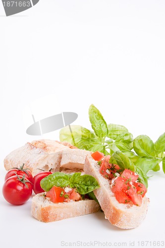 Image of deliscious fresh bruschetta appetizer with tomatoes isolated