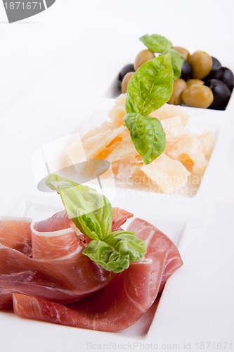 Image of deliscious antipasti plate with parma parmesan and olives