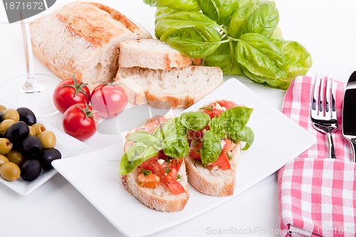 Image of deliscious fresh bruschetta appetizer with tomatoes isolated