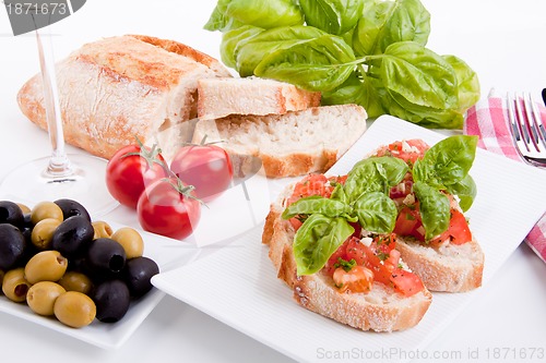 Image of deliscious fresh bruschetta appetizer with tomatoes isolated