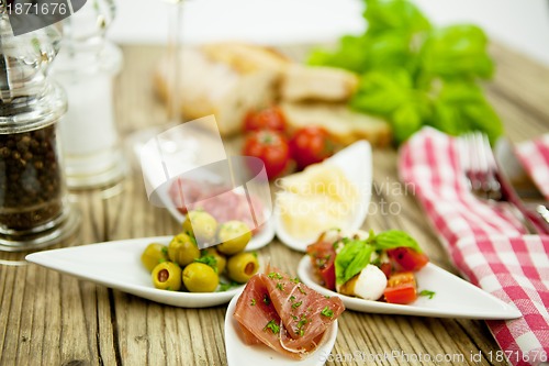 Image of deliscious antipasti plate with parma parmesan olives 