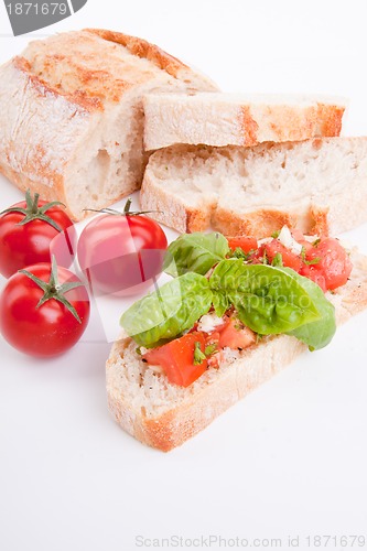 Image of deliscious fresh bruschetta appetizer with tomatoes isolated