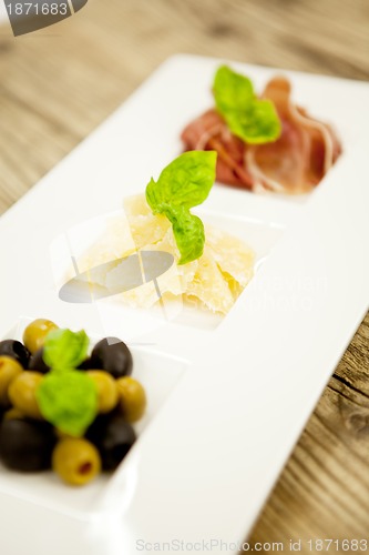 Image of deliscious antipasti plate with parma parmesan olives 