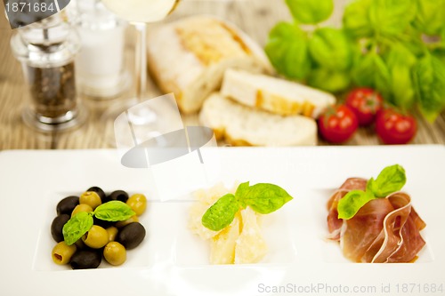 Image of deliscious antipasti plate with parma parmesan olives 