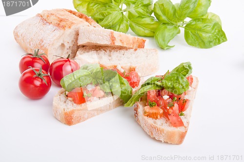 Image of deliscious fresh bruschetta appetizer with tomatoes isolated