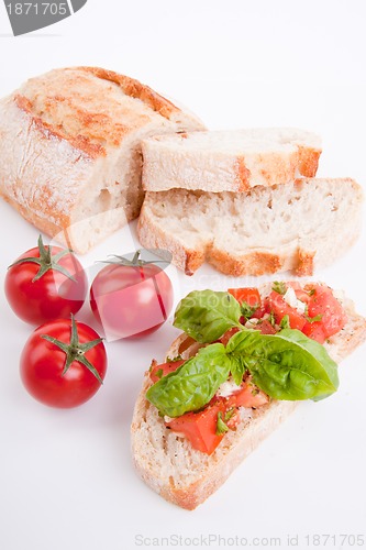 Image of deliscious fresh bruschetta appetizer with tomatoes isolated