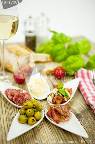 Image of deliscious antipasti plate with parma parmesan olives 