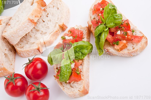 Image of deliscious fresh bruschetta appetizer with tomatoes isolated