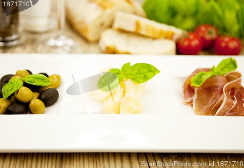 Image of deliscious antipasti plate with parma parmesan olives 