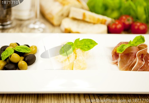 Image of deliscious antipasti plate with parma parmesan olives 