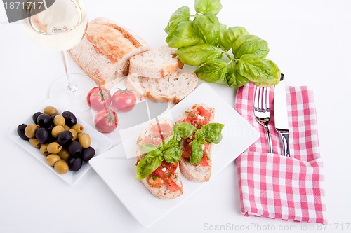 Image of deliscious fresh bruschetta appetizer with tomatoes isolated