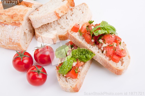 Image of deliscious fresh bruschetta appetizer with tomatoes isolated