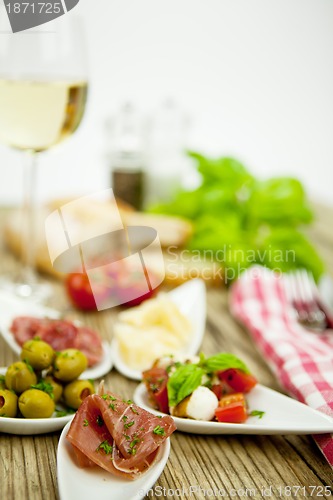 Image of deliscious antipasti plate with parma parmesan olives 