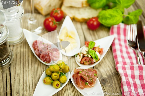 Image of deliscious antipasti plate with parma parmesan olives 