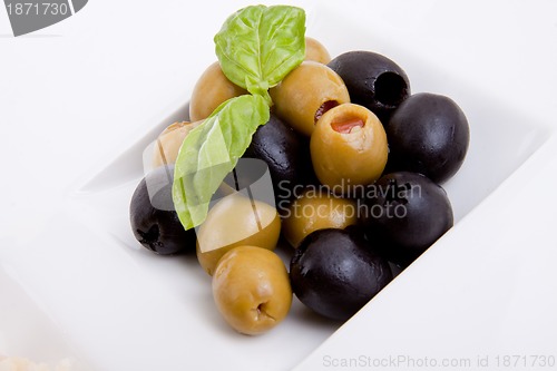 Image of deliscious antipasti plate with parma parmesan and olives