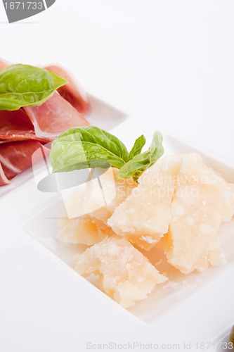 Image of deliscious antipasti plate with parma parmesan and olives