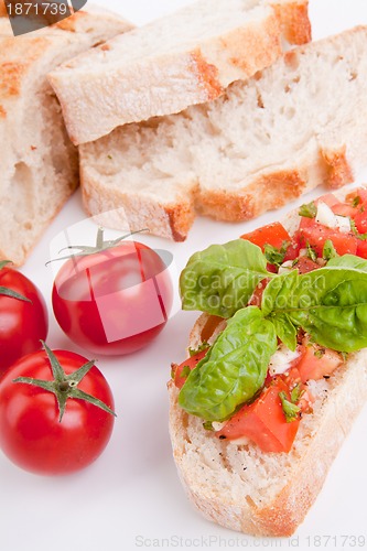 Image of deliscious fresh bruschetta appetizer with tomatoes isolated