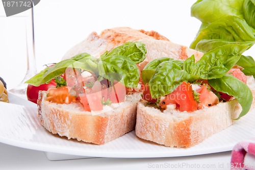 Image of deliscious fresh bruschetta appetizer with tomatoes isolated