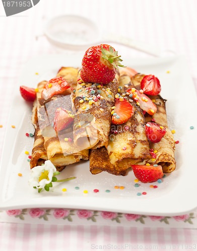 Image of Rolled crepes with fresh strawberries