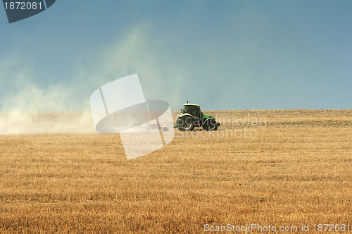 Image of Tractor plowing field