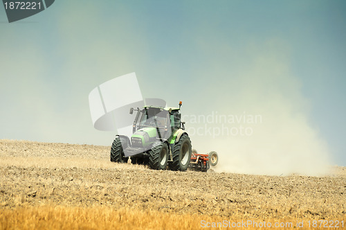 Image of Tractor plowing field