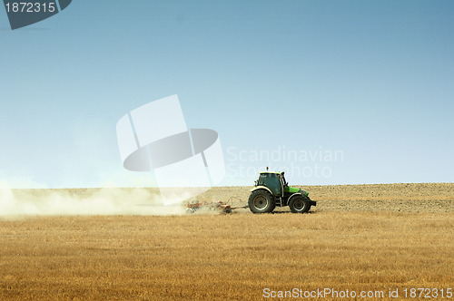 Image of Tractor plowing field