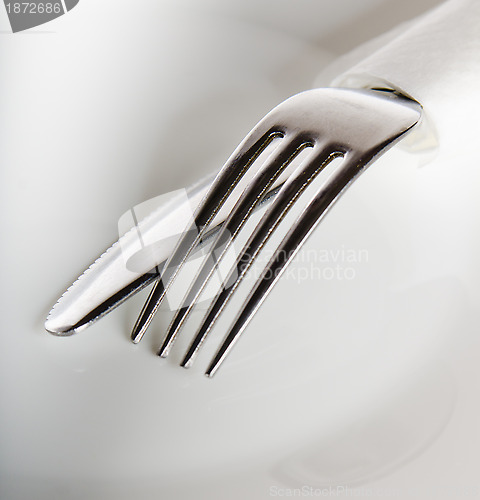 Image of Plug and knife on a white plate