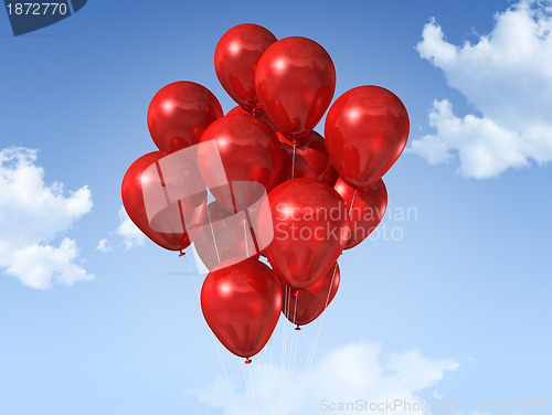 Image of red balloons on a blue sky