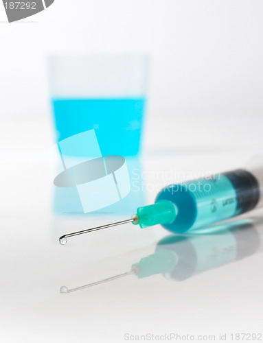 Image of Syringe with blue liquid