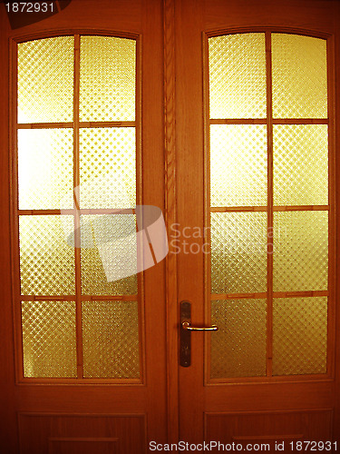 Image of Beautiful wooden door with glasses