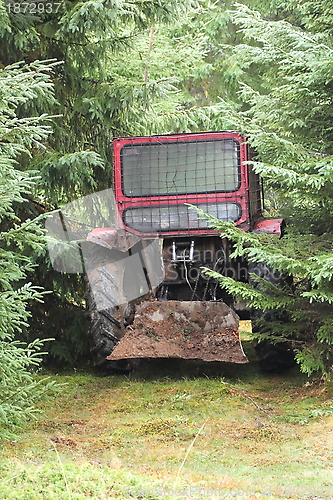 Image of tractor left in the woods