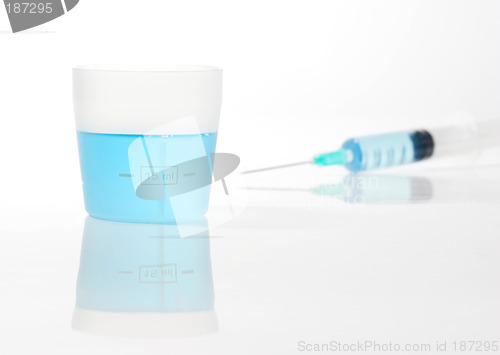 Image of Syringe with blue liquid